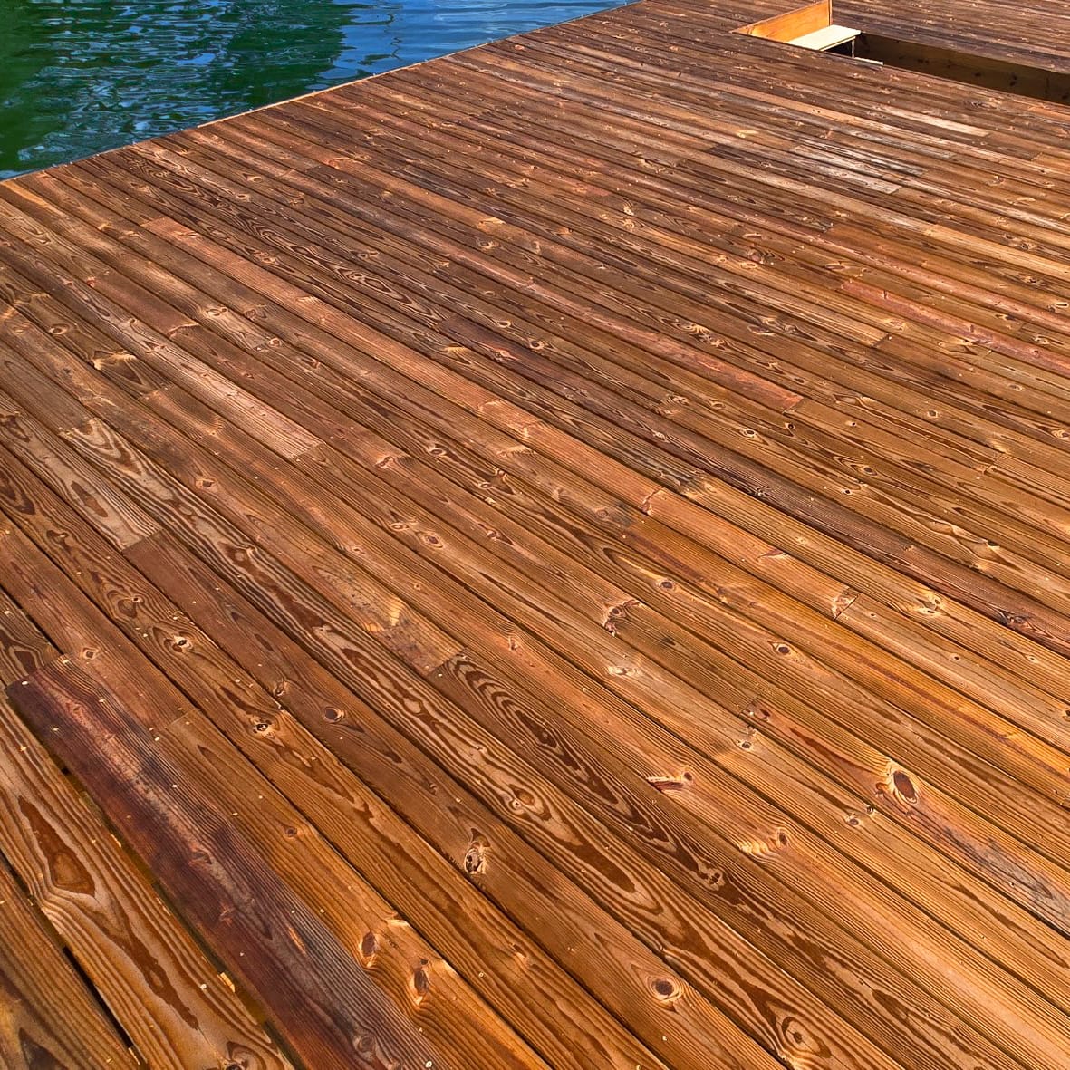 Lake Martin dock re-decked with new pressure-treated 5/4 pine boards